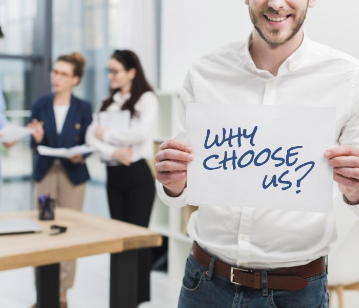 business-man-holding-paper-with-why-choose-us-question